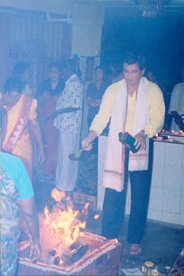 Atan
            blessing the fire ceremony